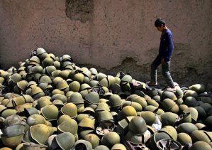 Afghan Boy with Russian Helmets